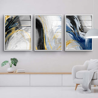 Modernes Wandbild-Set mit abstrakten Farbverläufen in Gold, Blau, Schwarz und Weiß im Wohnzimmer