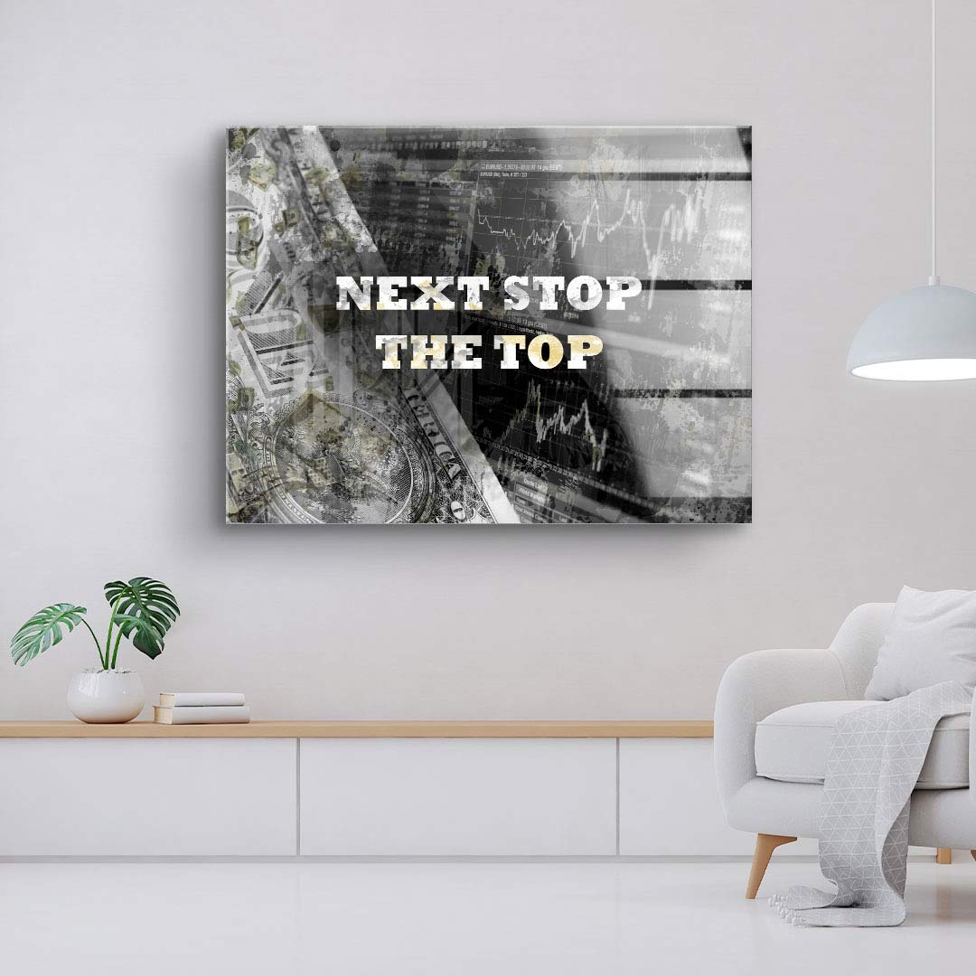 Modernes Wandbild im Wohnzimmer mit Motivationsspruch und abstrakter Börsen-Grafik