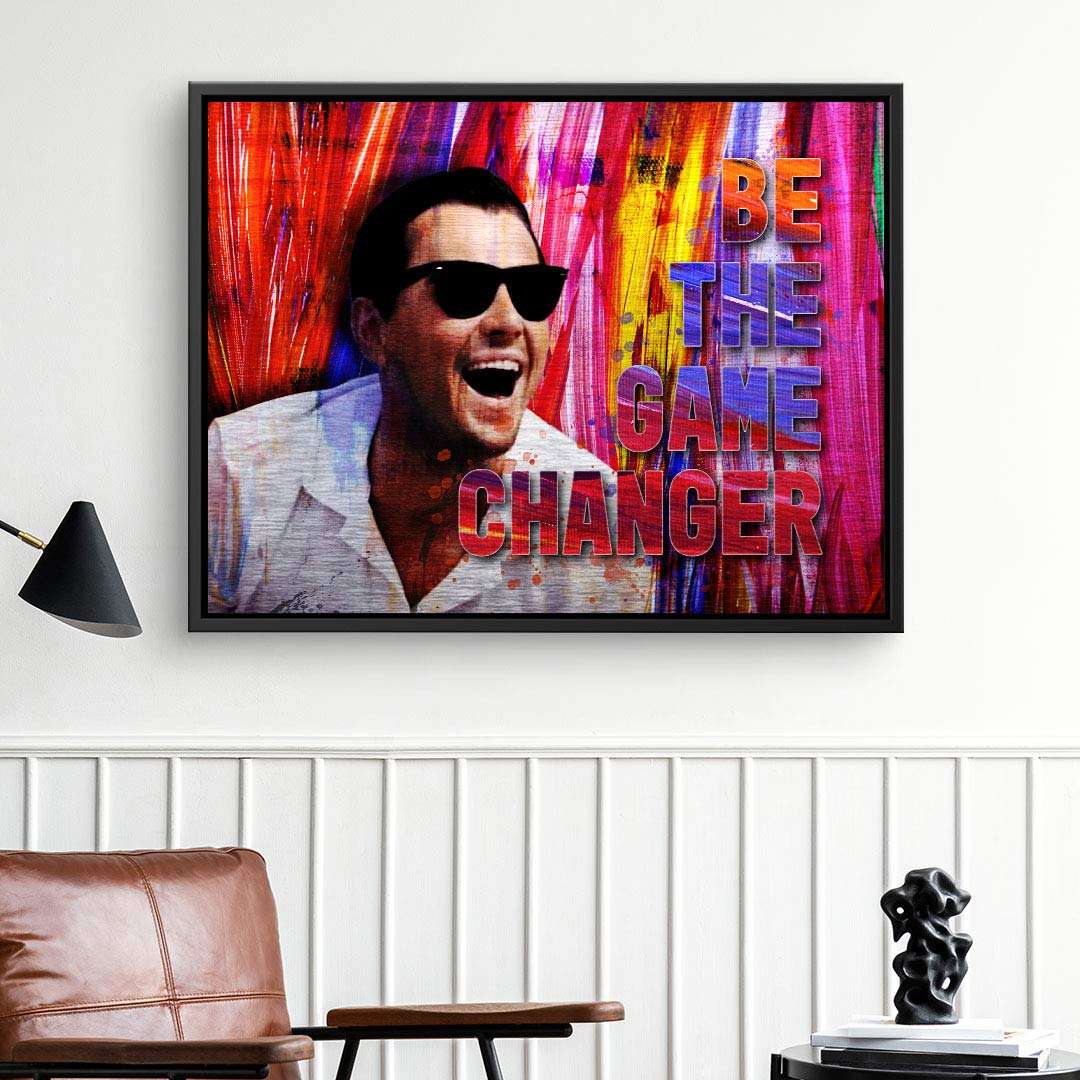 Modernes Wandbild auf Leinwand mit lachendem Mann, Sonnenbrille und Spruch BE THE GAME CHANGER, bunter Hintergrund, Wohnzimmer-Deko.