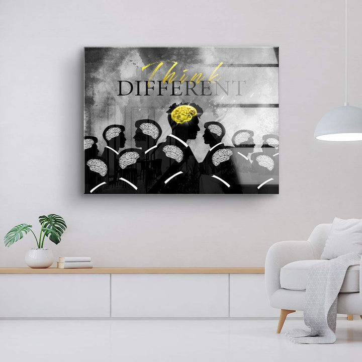 Modernes Wandbild mit schwarzen Silhouetten, Gehirnen und gelbem Akzent, Aufschrift 'Think Different'