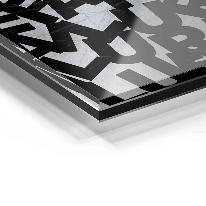 Detailaufnahme Wandbild auf Acrylglas, moderne schwarze Typografie auf transparentem Untergrund