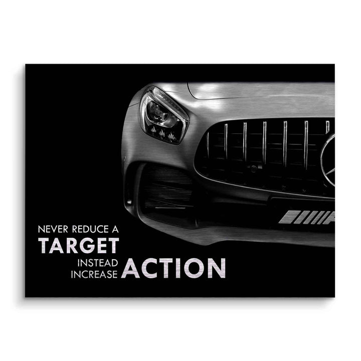 Motivationsbild mit Frontansicht eines sportlichen Autos und englischem Motivationsspruch auf schwarzem Hintergrund.