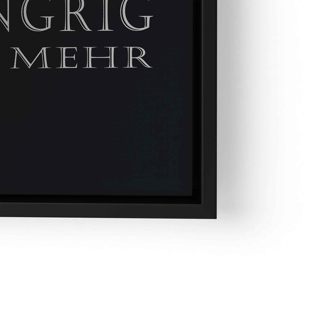Motivationsbild mit Text in stilvoller Serifenschrift in schwarzem Bilderrahmen, Detailansicht