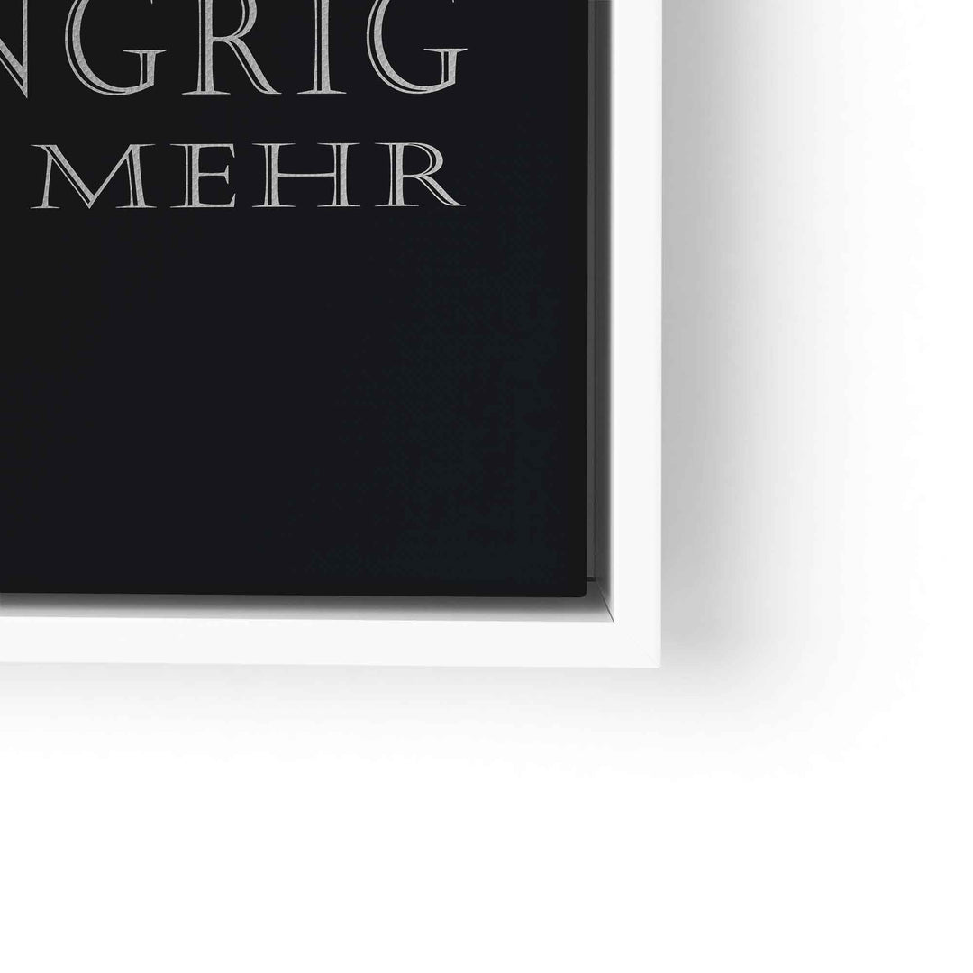 Motivationsbild auf Leinwand mit weißer Schrift auf schwarzem Hintergrund, im weißen Rahmen