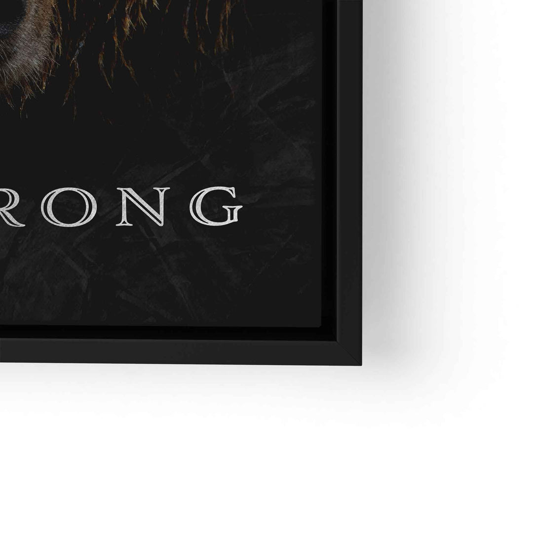 Teil eines Motivationsbilds mit Braunbär und Text 'STRONG' auf dunklem Hintergrund, gerahmt.