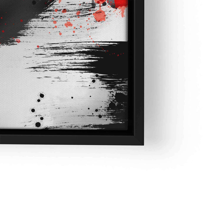 Abstraktes Wandbild mit schwarzen und roten Farbspritzern auf weißem Hintergrund
