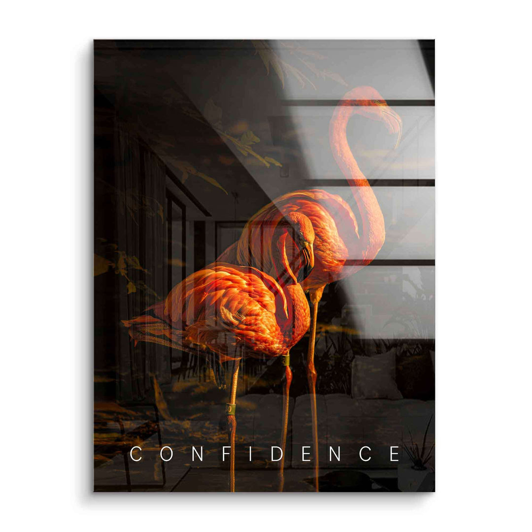Modernes Acrylglas-Wandbild mit zwei leuchtend orangefarbenen Flamingos und dem Schriftzug Confidence
