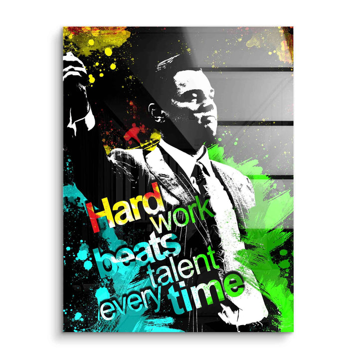 Motivationsbild auf Acrylglas mit Mann im Anzug, bunter Spruch 'Hard work beats talent every time'.