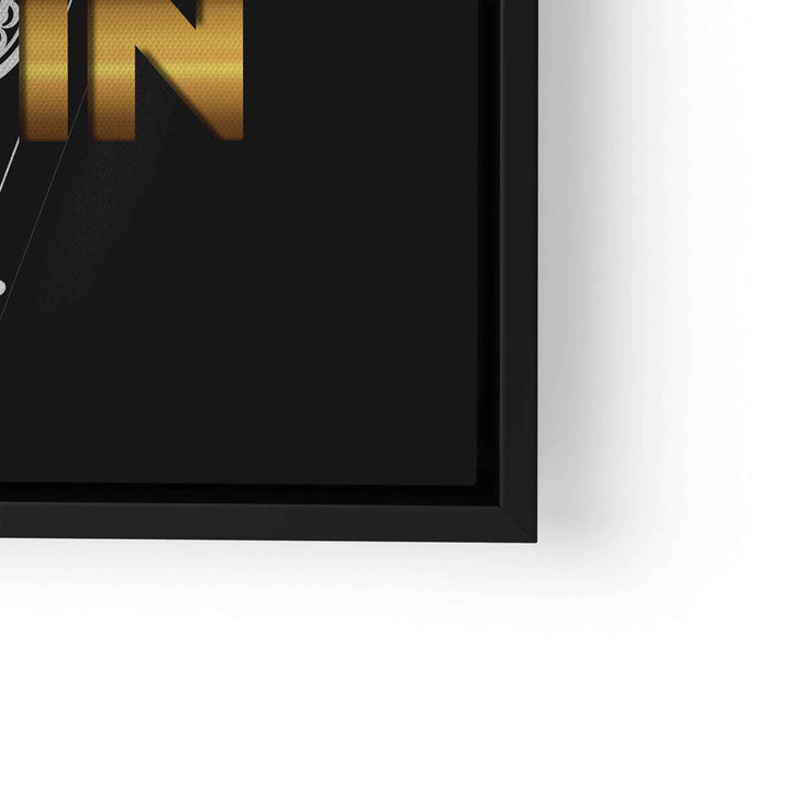 Schwarzes gerahmtes Wandbild mit goldenem Motivationsschriftzug auf dunklem Hintergrund