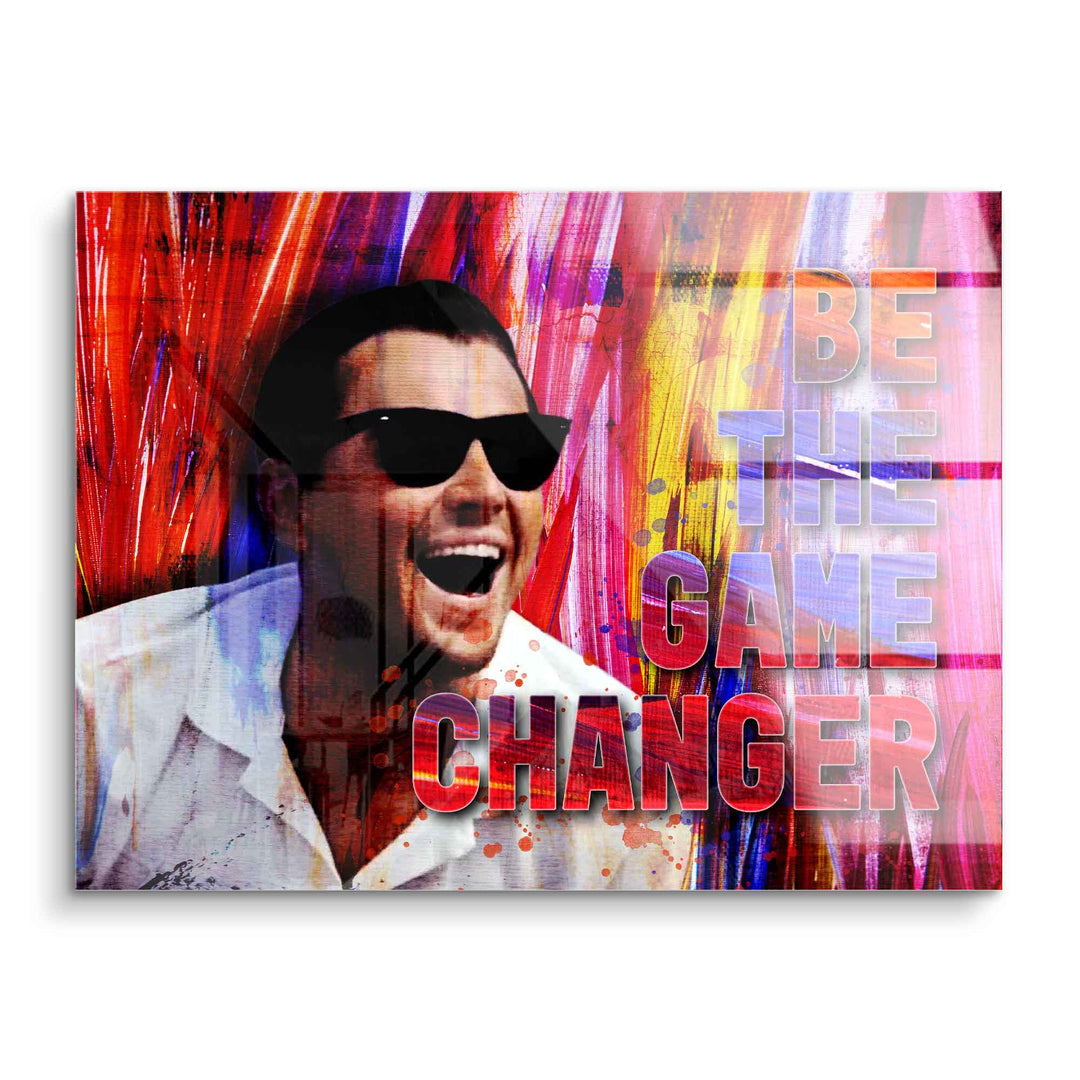 Motivationsbild mit lachendem Mann in Sonnenbrille vor buntem Hintergrund und Text 'Be the Game Changer'