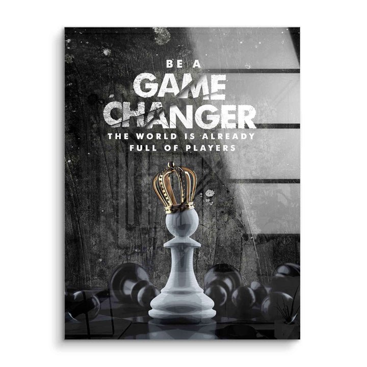 Motivationsbild Schachfigur Bauer mit Krone vor besiegten Figuren und Game Changer Spruch