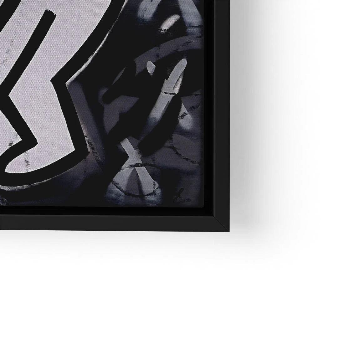 Detail eines modernen Wandbilds mit grafischem Schwarz-Weiß-Motiv in schwarzem Rahmen