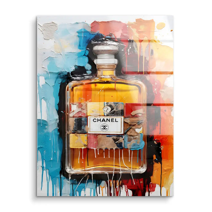 Modernes Acrylglas Wandbild mit Chanel Parfumflakon und bunten, abstrakten Farbspritzern