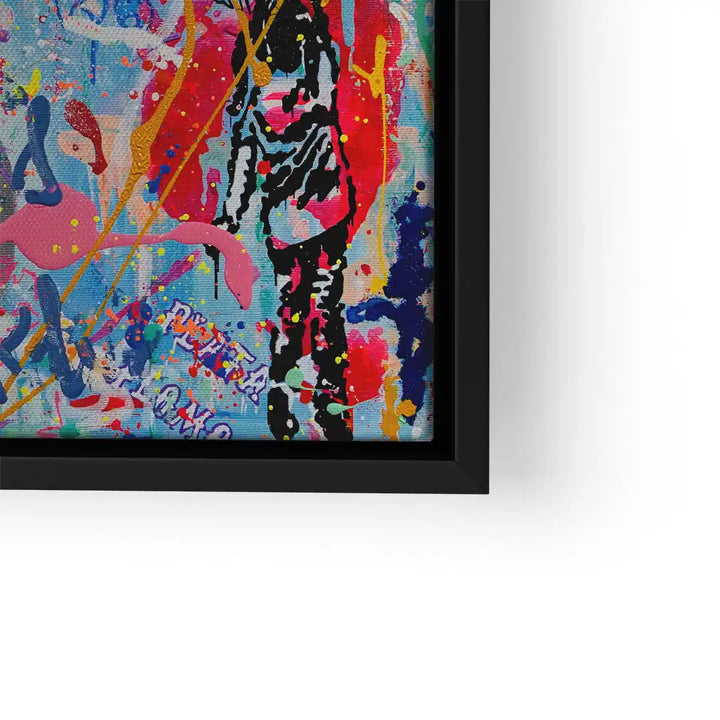 Buntes Pop Art Wandbild mit abstrakten Farbspritzern und schwarzer Figur, gerahmt