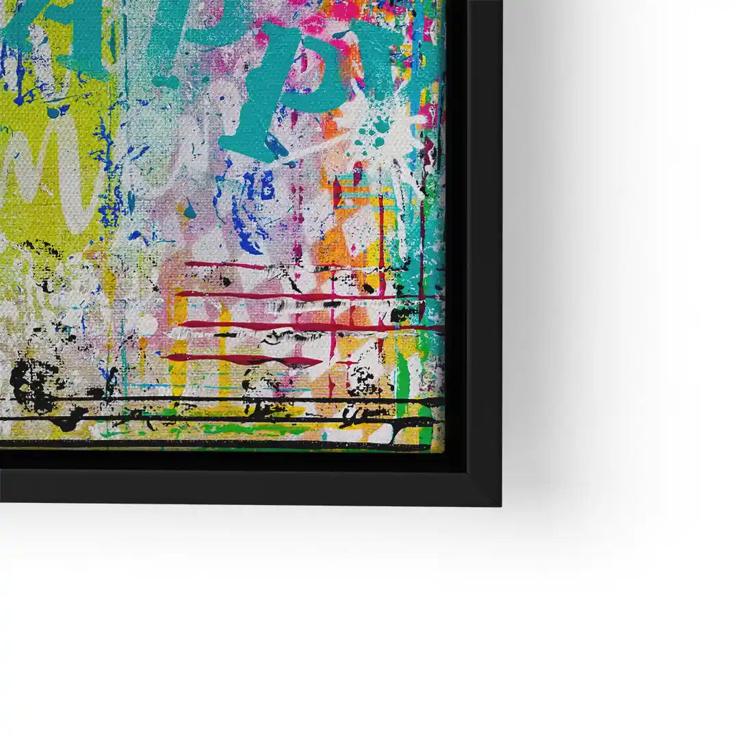Modernes abstraktes Wandbild mit bunten Graffiti-Elementen in schwarzem Rahmen.