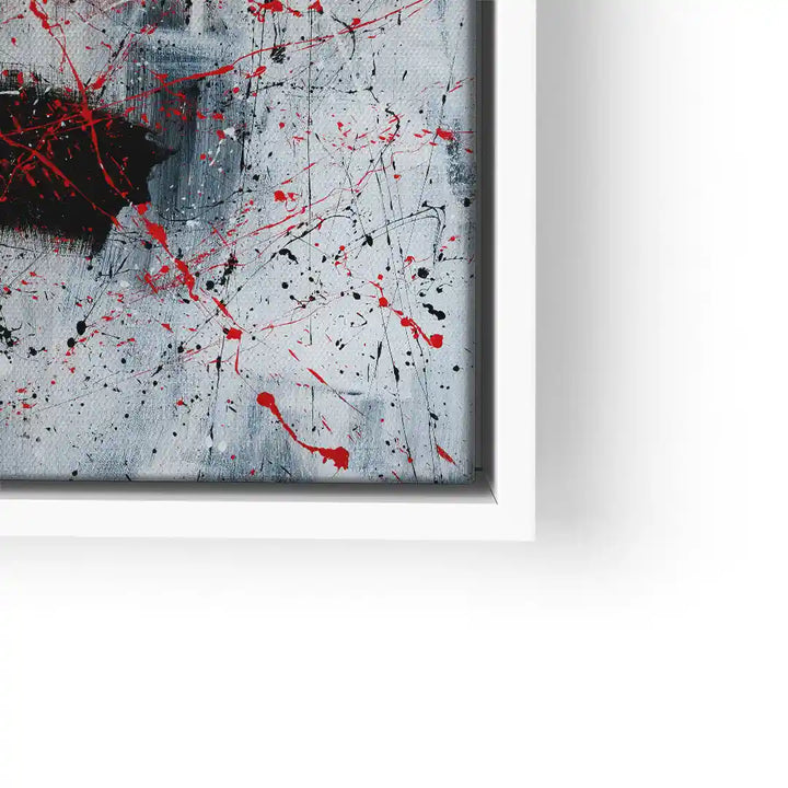 Modernes abstraktes Wandbild mit schwarzen und roten Farbspritzern auf grauem Hintergrund