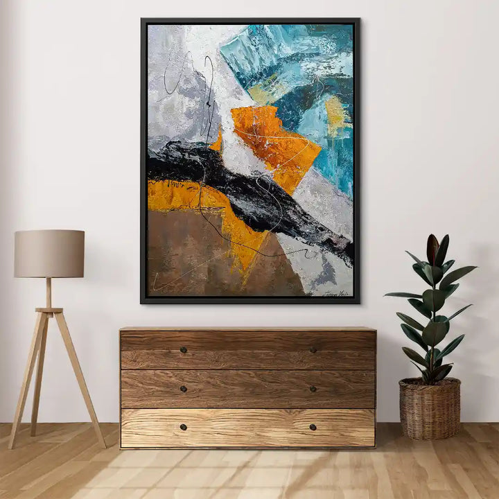 Abstraktes Wandbild mit bunten Akzenten in Orange, Blau und Schwarz über Kommode im modernen Wohnzimmer