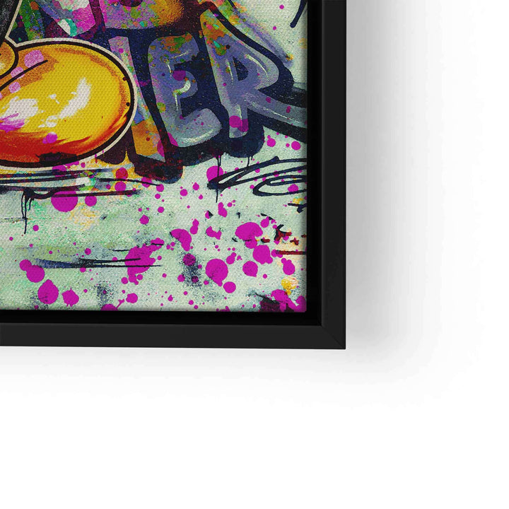 Detail eines Wandbilds im Graffiti-Stil mit bunten Farbspritzern und Comic-Elementen
