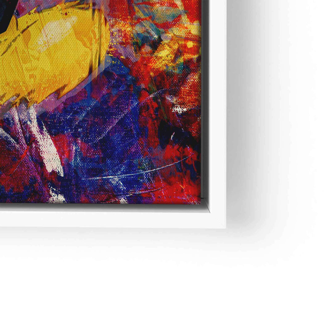 Detail eines bunten Wandbilds mit abstrakten Farben in Rot, Blau, Gelb und weißem Rahmen.