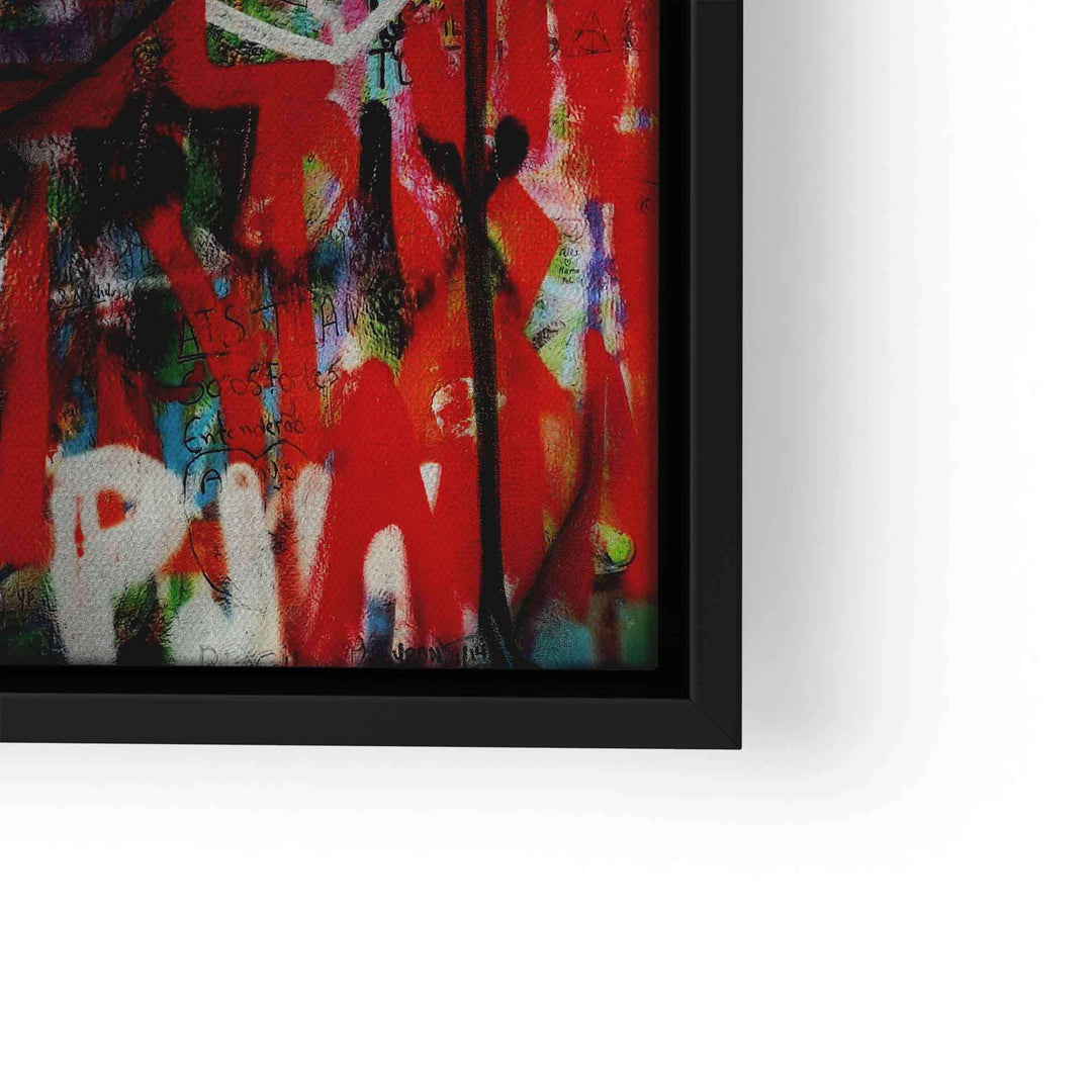 Ausschnitt eines Pop Art Wandbilds mit bunten, abstrakten Graffiti-Elementen in Schwarz, Rot und Weiß, eingerahmt in schwarzem Rahmen.