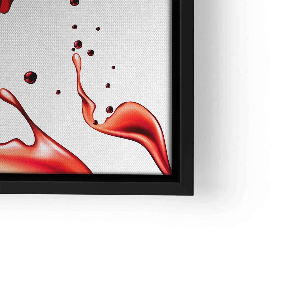 Nahaufnahme eines modernen Pop Art Wandbilds mit roter Spritzflüssigkeit im schwarzen Rahmen