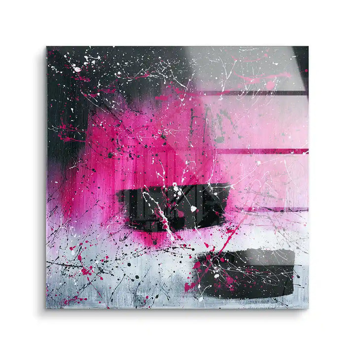 Abstraktes Wandbild mit pinken, schwarzen und weißen Farbspritzern auf Acrylglas