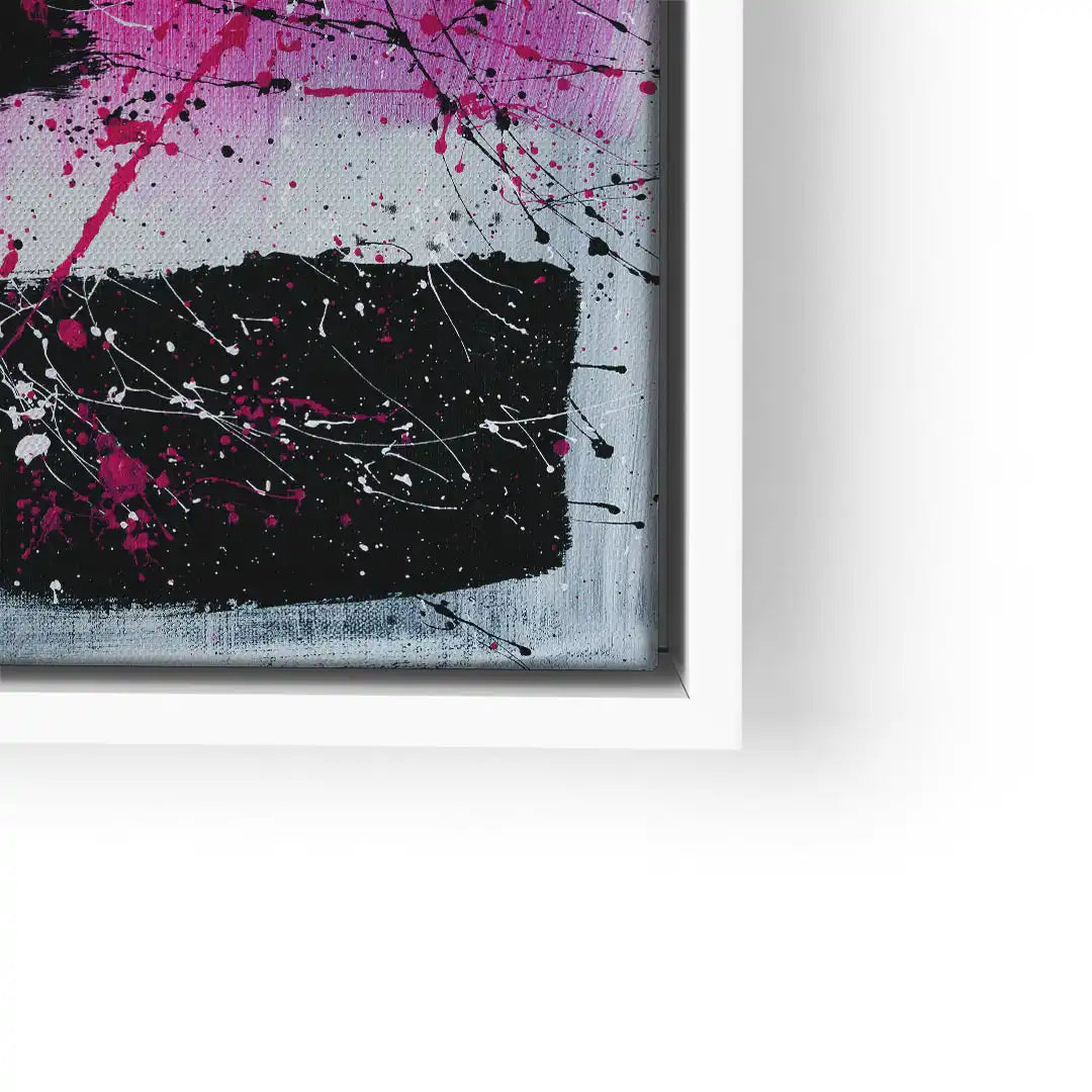 Abstraktes Wandbild mit schwarzen, weißen und pinken Farbspritzern auf Leinwand im Rahmen