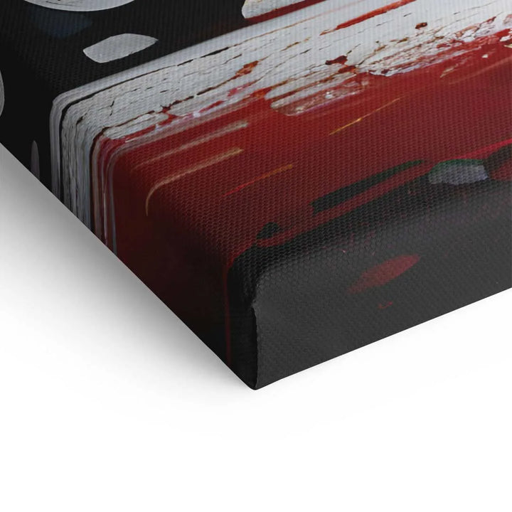 Detailaufnahme Leinwandbild mit abstrakten Farbklecksen in Rot, Weiß und Schwarz