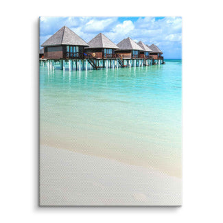 Wandbild mit tropischem Meer, Pfahlbauten und türkisblauem Wasser auf Leinwand