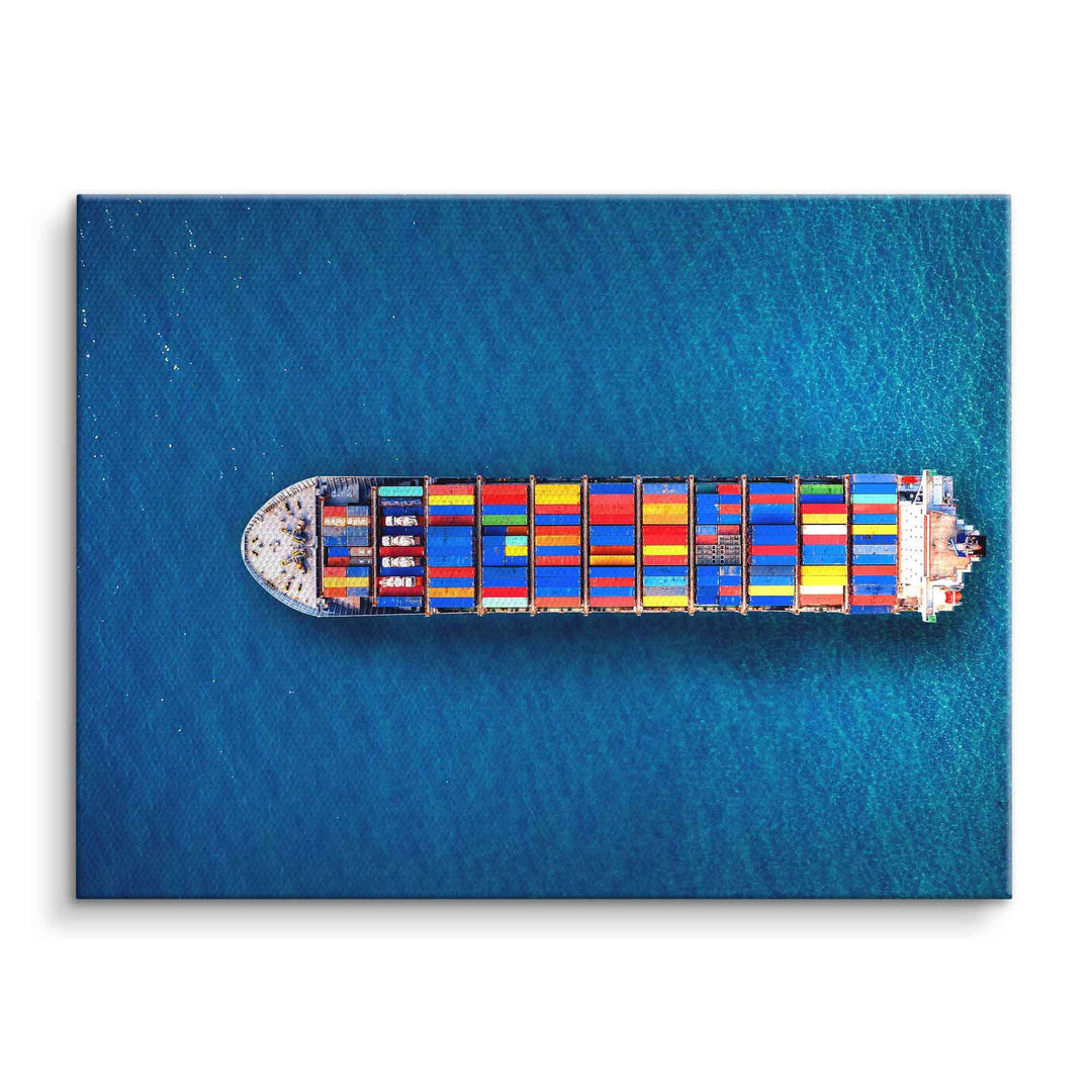 Luftaufnahme Containerschiff mit bunten Containern auf blauem Meer als Wandbild